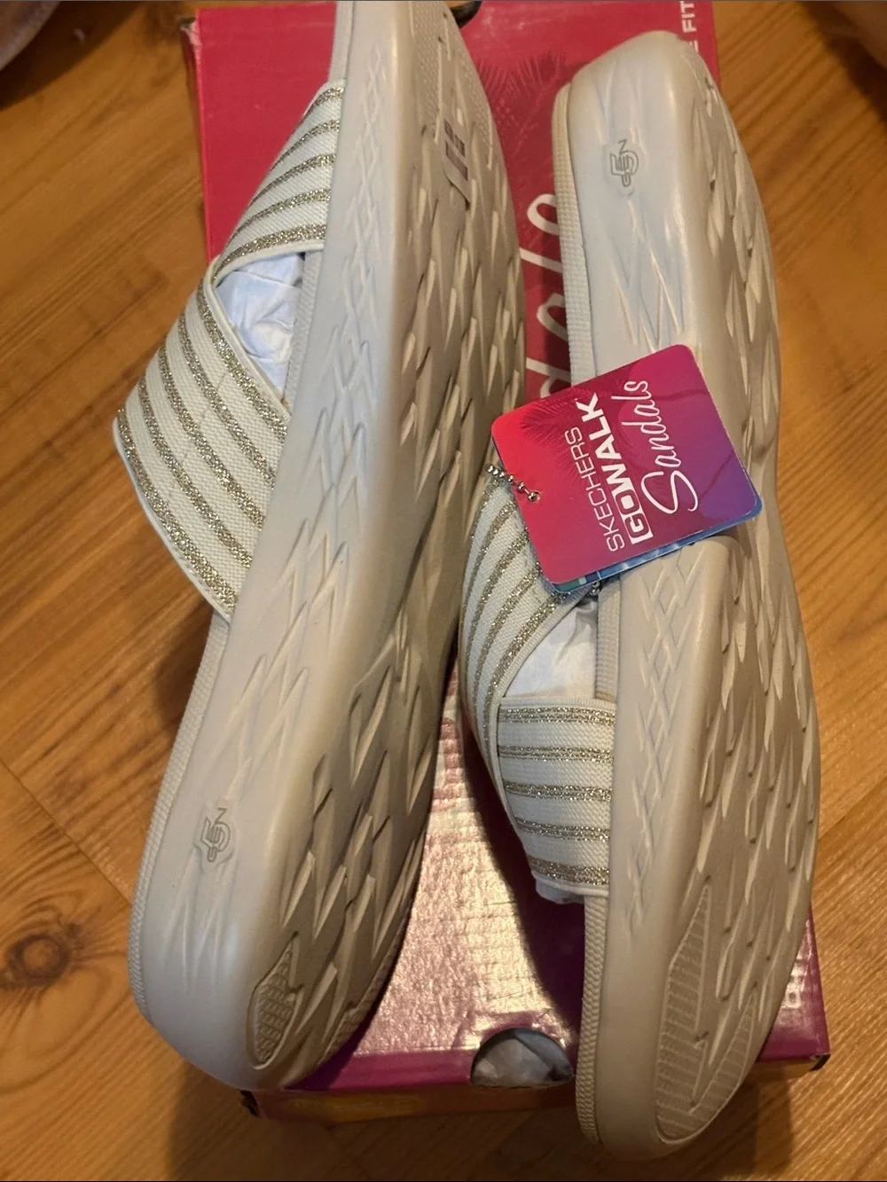Skechers Women's Cream Slide Sandals with Gold Stripe Cross Straps